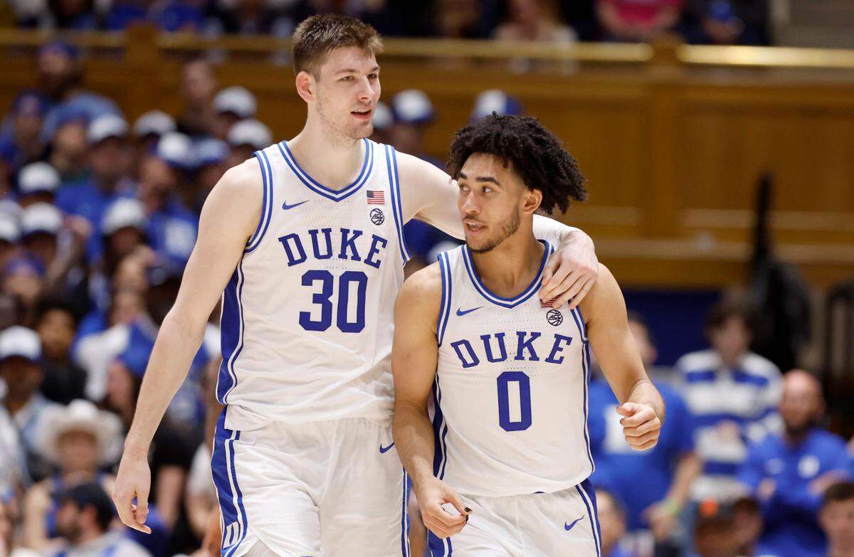 Duke’s Kyle Filipowski (30) walks down the court with Jared McCain (0) during the second half of Duke’s 84-59 victory over Louisville at Cameron Indoor Stadium in Durham, N.C., Wednesday, Feb. 28, 2024.