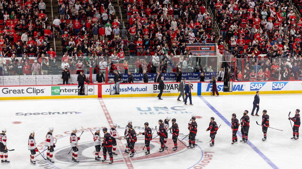 The Carolina Hurricanes and the New Jersey Devils go through the handshake line after the Hurricanes 5-4 double overtime victory on Tuesday, April 29, 2025 at Lenovo Center in Raleigh, N.C.