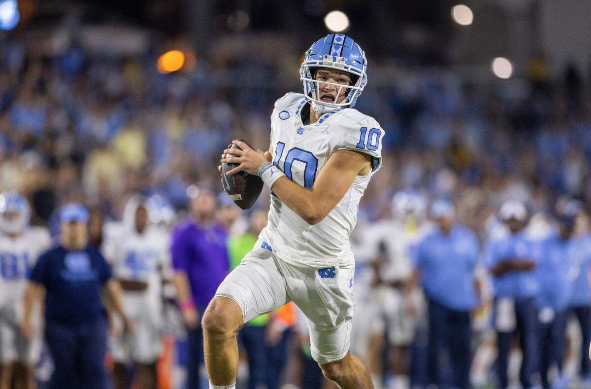 North Carolina quarterback Drake Maye (10) scores on a 14-yard run against Georgia Tech in 2023.