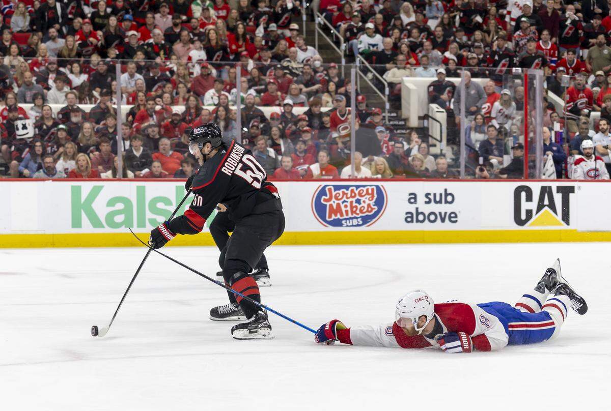 Carolina Hurricanes left wing Eric Robinson (50) breaks away from Montreal defenseman Mike Matheson (8) to score, giving the Hurricanes’ a 3-0 lead in the first period in Game 5 of the Eastern Conference Finals against Montreal on Friday, May 29, 2026 at Lenovo Center in Raleigh, N.C.
