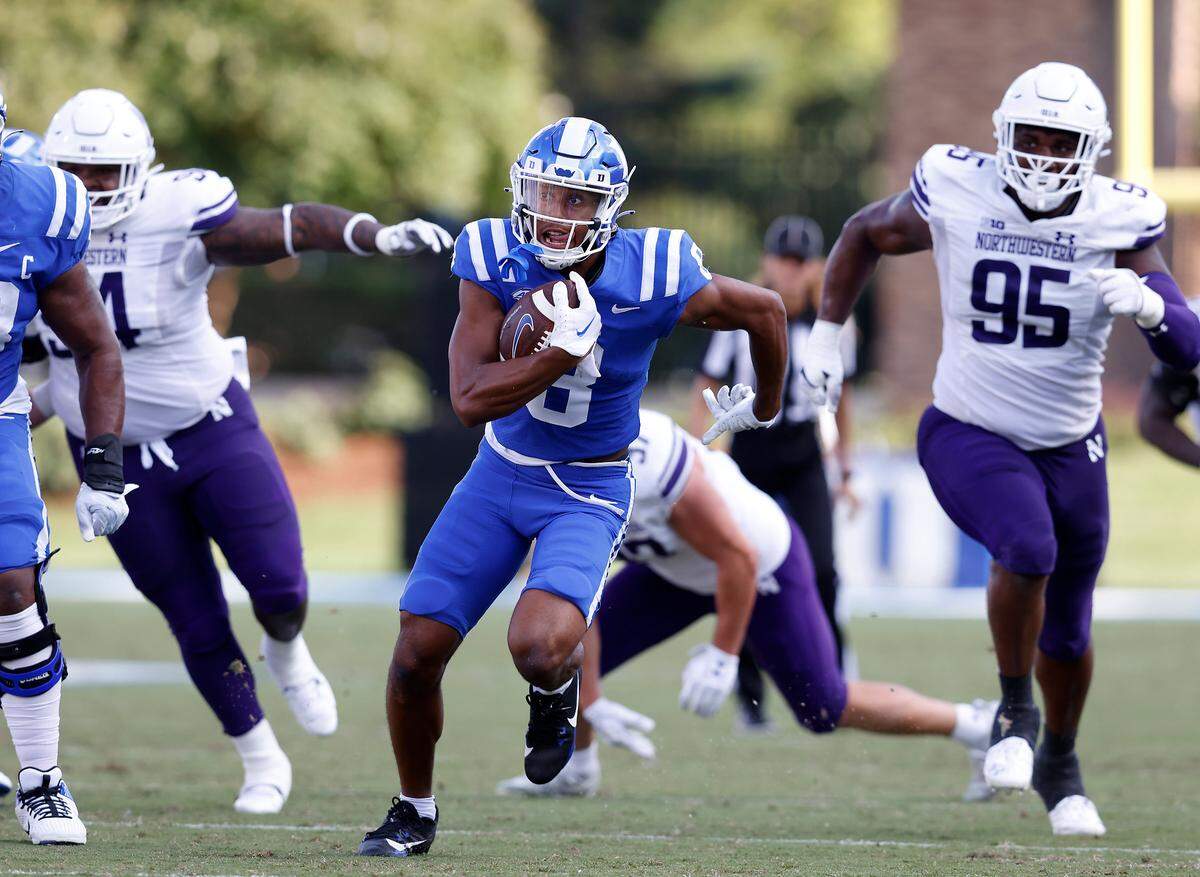 Duke’s Jordan Moore runs the ball during the second half of the Blue Devils’ 38-14 win over Northwestern on Saturday, Sept. 16, 2023, at Wallace Wade Stadium in Durham, N.C.