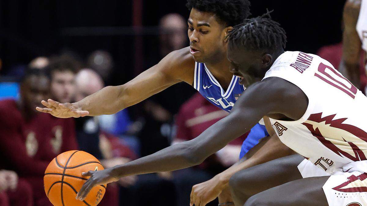 Duke’s Sean Stewart (13) heads to steal the ball from Florida State’s Taylor Bol Bowen (10) during the second half of Duke’s 76-67 victory over Florida State University at the Tucker Center in Tallahassee, Fla. Sat. February 17, 2024.