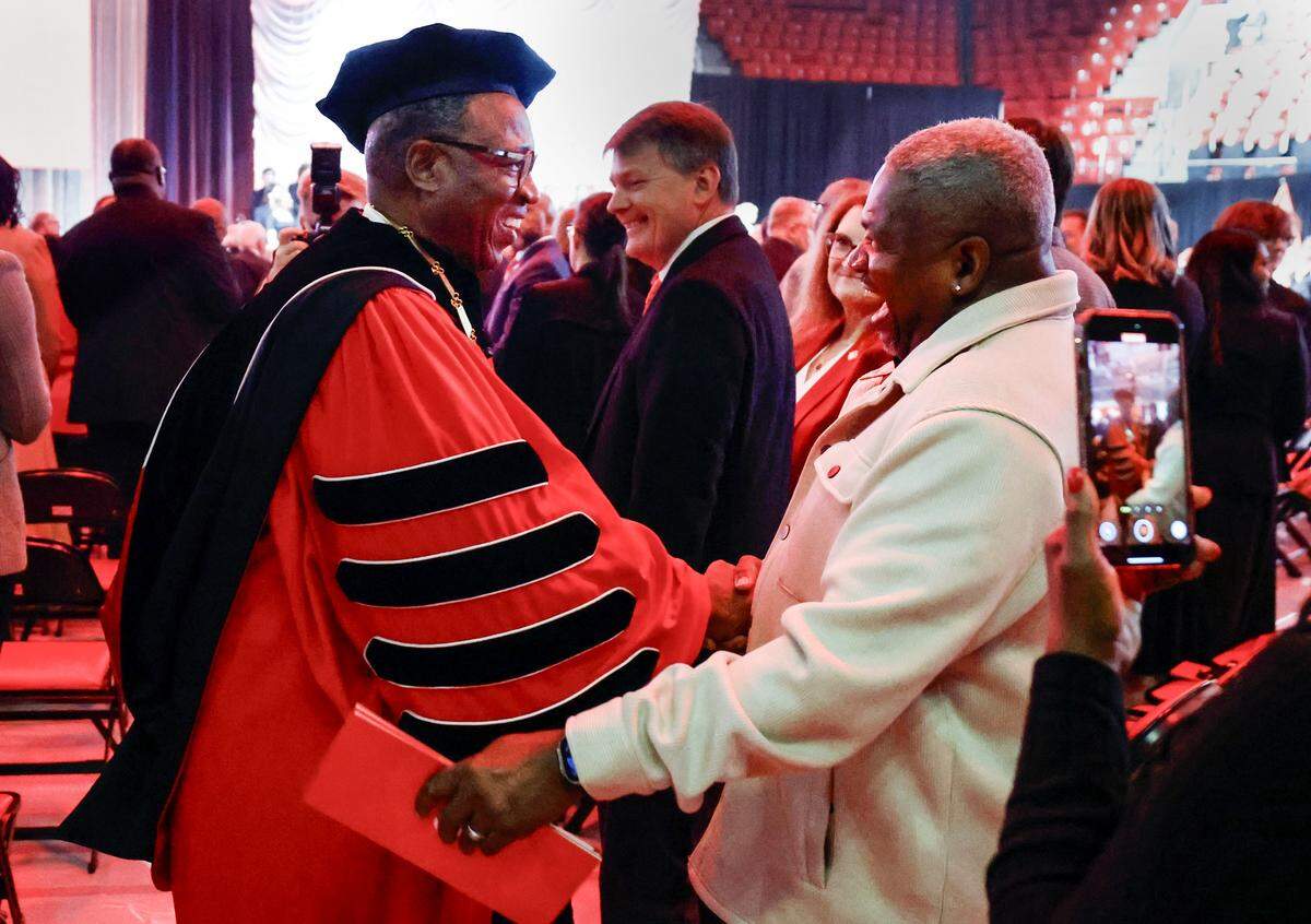 N.C. State Chancellor Kevin Howell greets Timothy Figgins, his fraternity brother, after HowellÕs installation ceremony at Reynolds Coliseum in Raleigh, N.C., Thursday, Oct. 30, 2025.