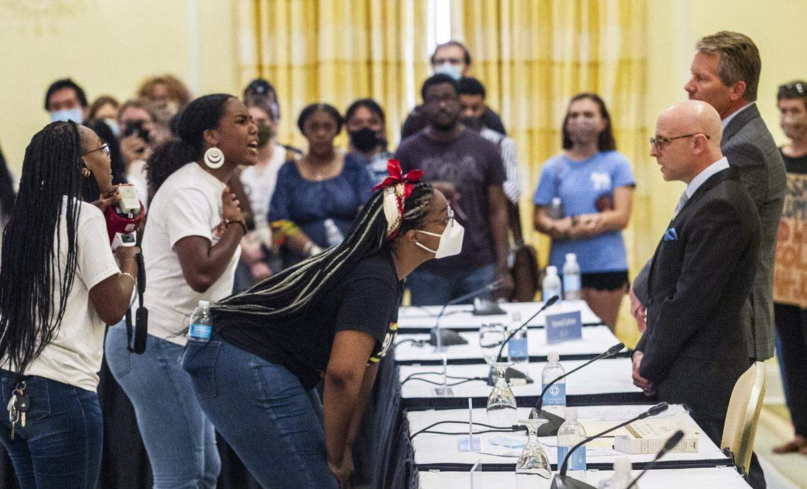 Demonstrators confront Gene Davis, vice chairman of the UNC-Chapel Hill Board of Trustees, and Chancellor Kevin Guskiewicz after the board voted to approve tenure for distinguished journalist Nikole Hannah-Jones Wednesday, June 30, 2021 at Carolina Inn in Chapel Hill.