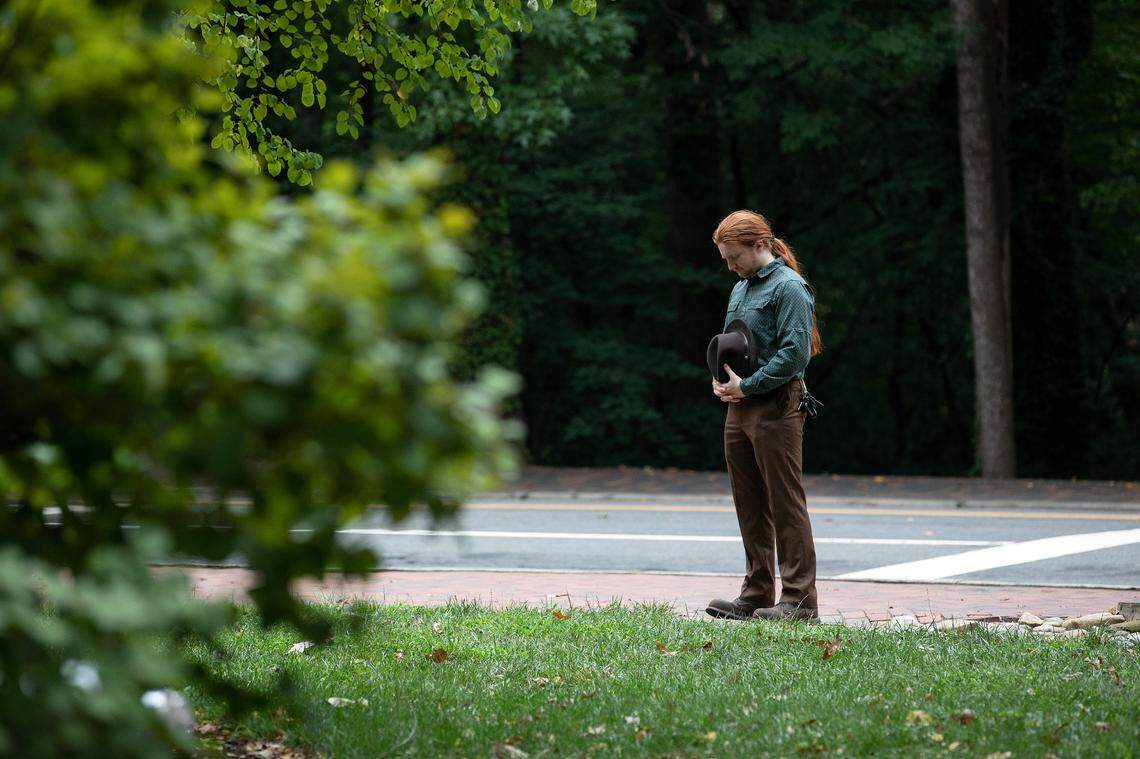 A person pauses outside of Caudill Laboratories on the campus of UNC-Chapel Hill on Tuesday, Aug. 29, 2023. A graduate student was arrested and charged with first-degree murder following a Monday shooting at the laboratories that left a member of the faculty dead.