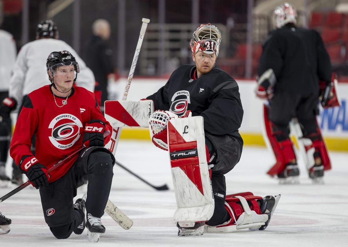 Carolina Hurricanes right wing Jackson Blake (53) and goalie Frederik Andersen (31) take a break during practice on Friday, May 15, 2026 at Lenovo Center in Raleigh, N.C.