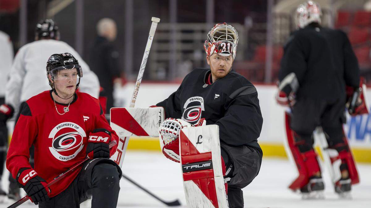 Carolina Hurricanes right wing Jackson Blake (53) and goalie Frederik Andersen (31) take a break during practice May 15, ahead of Thursday’s game against the Montreal Canadiens at the Lenovo Center.