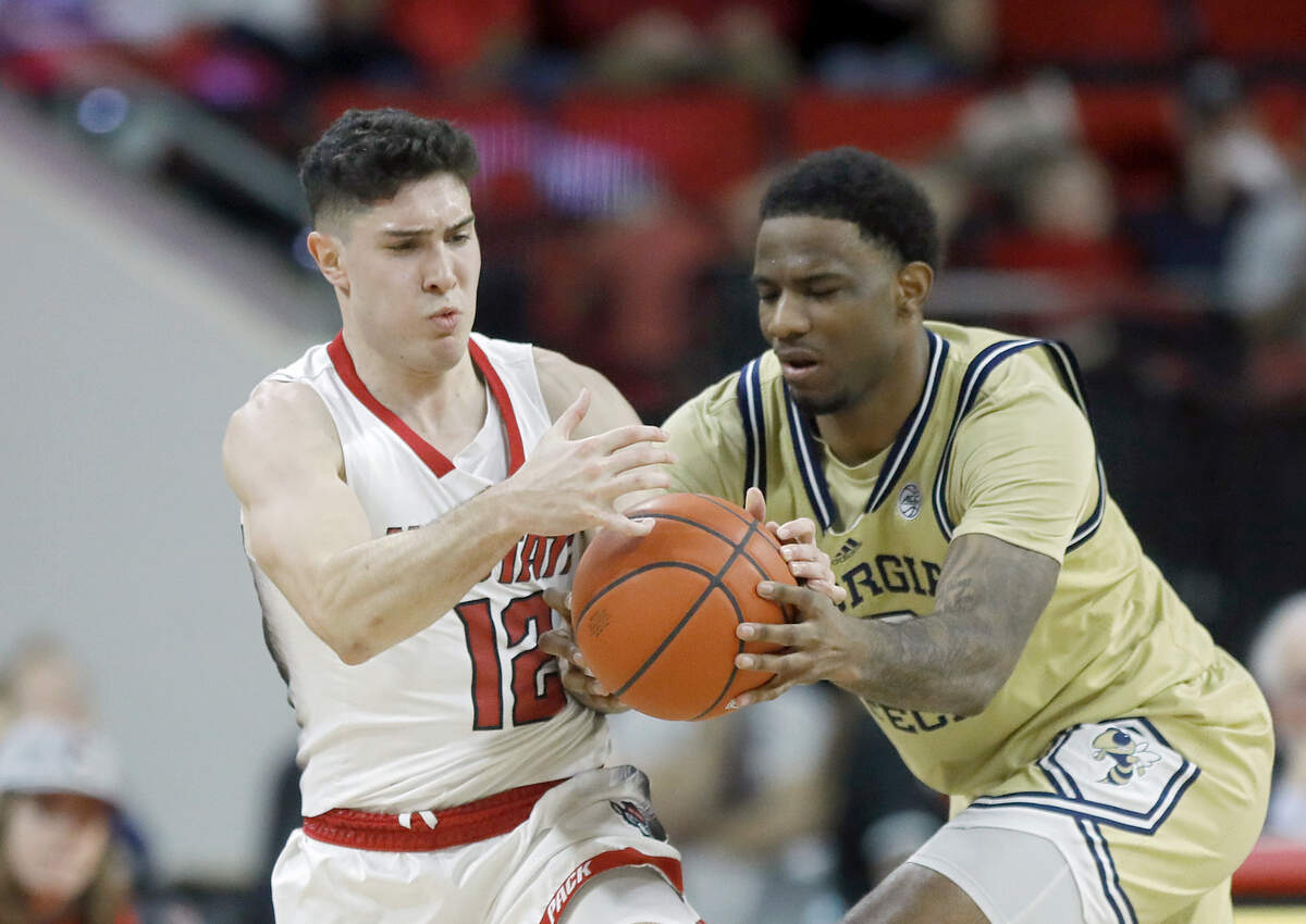 N.C. State’s Michael O’Connell pressures Georgia Tech’s Tyzhaun Claude during the second half of the Wolfpack’s 82-76 win on Saturday, Feb. 3, 2024, at PNC Arena in Raleigh, N.C.
