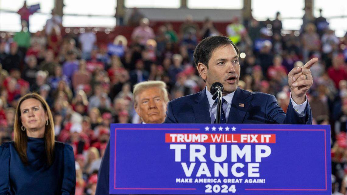 Florida Sen. Marco Rubio speaks as Republican presidential nominee and former President Donald Trump and Arkansas Gov. Sarah Huckabee Sanders look on during a rally at Dorton Arena in Raleigh on Monday, Nov. 4, 2024, one day before Election Day.