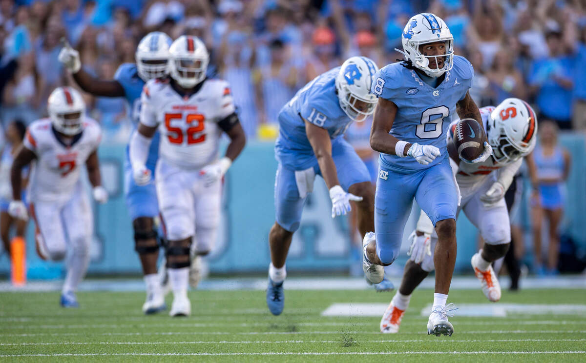North Carolina’s Kobe Paysour (8) races to the end zone for a 76-yard touchdown on a pass from quarterback Drake Maye to give the Tar Heels’ a 37-7 lead in the third quarter on Saturday, October 7, 2023 at Kenan Stadium in Chapel Hill, N.C.