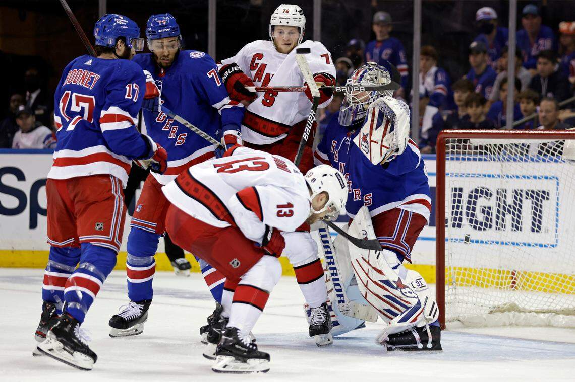 New York Rangers goaltender Igor Shesterkin (31) defends a deflection by Carolina Hurricanes defenseman Brady Skjei (76) during the second period of Game 3 of an NHL hockey Stanley Cup second-round playoff series, Sunday, May 22, 2022, in New York. (AP Photo/Adam Hunger)