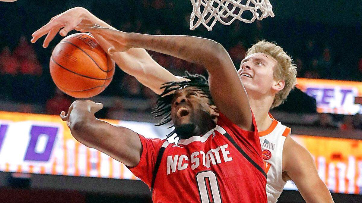 N.C. State’s D.J. Funderburk (0) is fouled by Clemson’s Hunter Tyson (5) during the first half of N.C. State’s game against Clemson at Littlejohn Coliseum in Clemson, S.C., Saturday, Jan. 4, 2020.