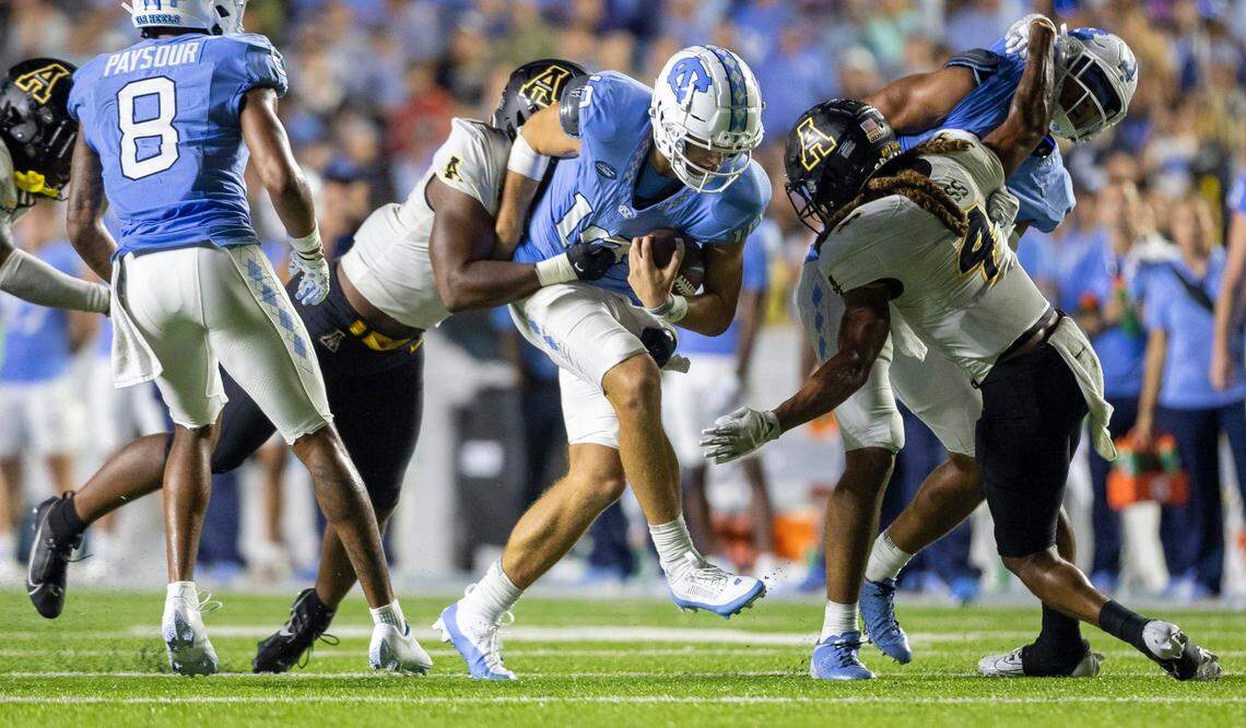 North Carolina quarterback Drake Maye (10) rushes for six-yards and a first down in the final minute of play against Appalachian State on Saturday September 9, 2023 at Kenan Stadium in Chapel Hill, N.C.