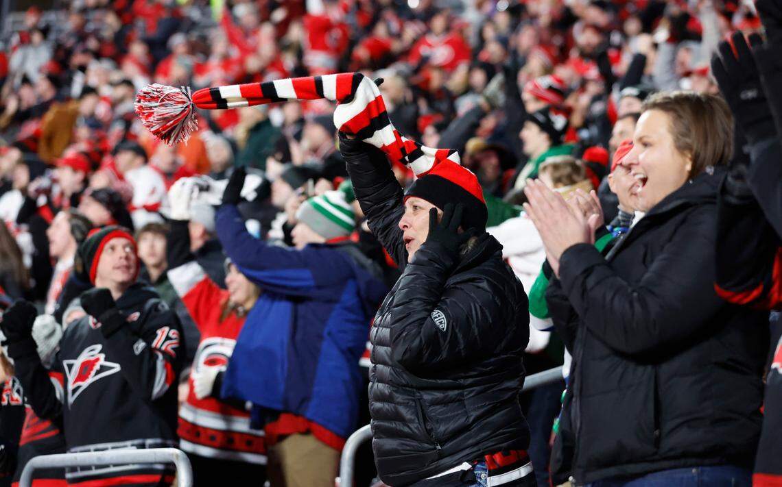 Melissa Solomon cheers on the Canes after they scored during the second period of the NHL Stadium Series game between the Carolina Hurricanes and the Washington Capitals at Carter-Finley Stadium in Raleigh, N.C., Saturday, Feb. 18, 2023.