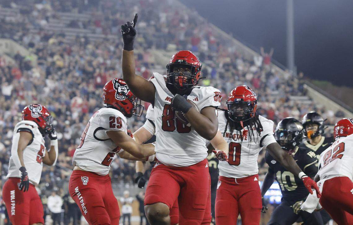 N.C. State defensive end Isaiah Shirley (88) celebrates while returning a interception for a touchdown during the first half of N.C. State’s game against Wake Forest at Allegacy Stadium in Winston-Salem, N.C., Thursday, Sept. 11, 2025.