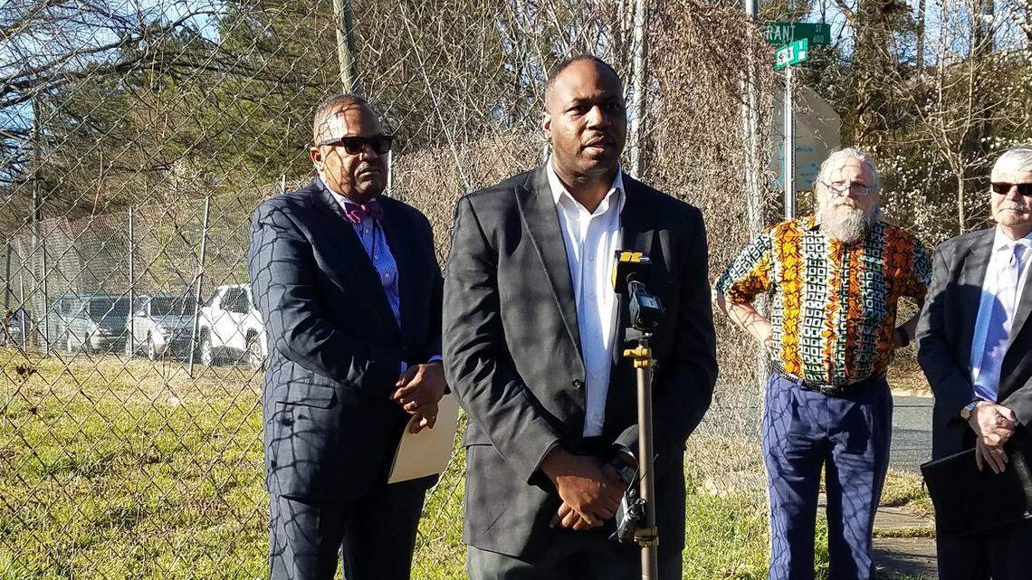 Henry McKoy of the Durham Committee on the Affairs of Black People, talks about the committee’s support for the Durham-Orange Light Rail Transit project because it could be an economic driver for the historic African American neighborhood of Hayti and along Fayetteville Street. Behind him on the left is N.C. Central Unversity Vice President of External Affairs Michael D. Page, Mike Broadway of Durham CAN and Durham Technical Community College President William Ingram.