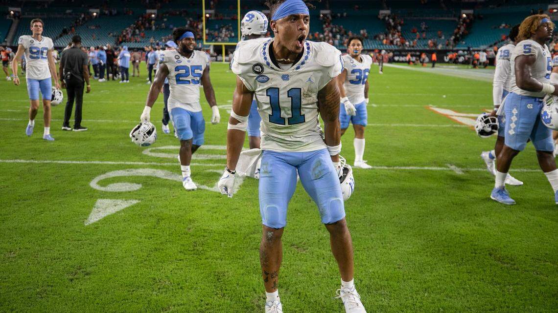 North Carolina wide receiver Josh Downs (11) reacts as he leaves the field with his teammate following their 27-24 victory over Miami on Saturday, October 8, 2022 at Hard Rock Stadium in Miami Gardens, Florida.