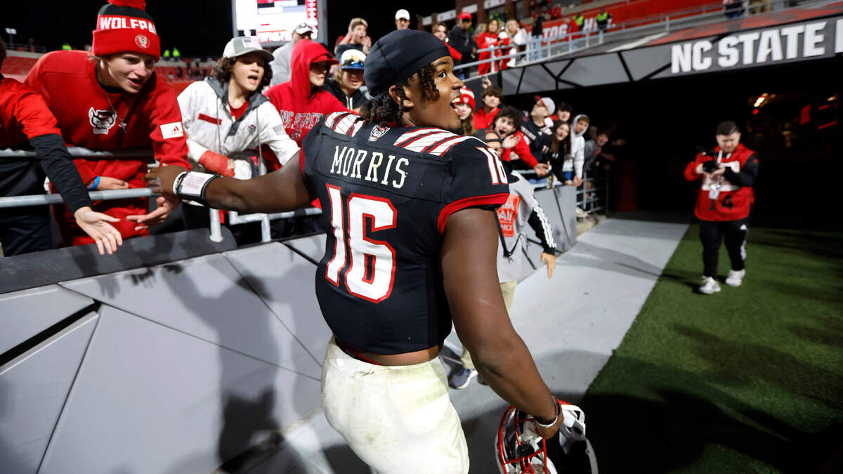 N.C. State quarterback MJ Morris (16) heads to the locker room after N.C. State’s 22-21 victory over Virginia Tech at Carter-Finley Stadium in Raleigh, N.C., Thursday, Oct. 27, 2022.