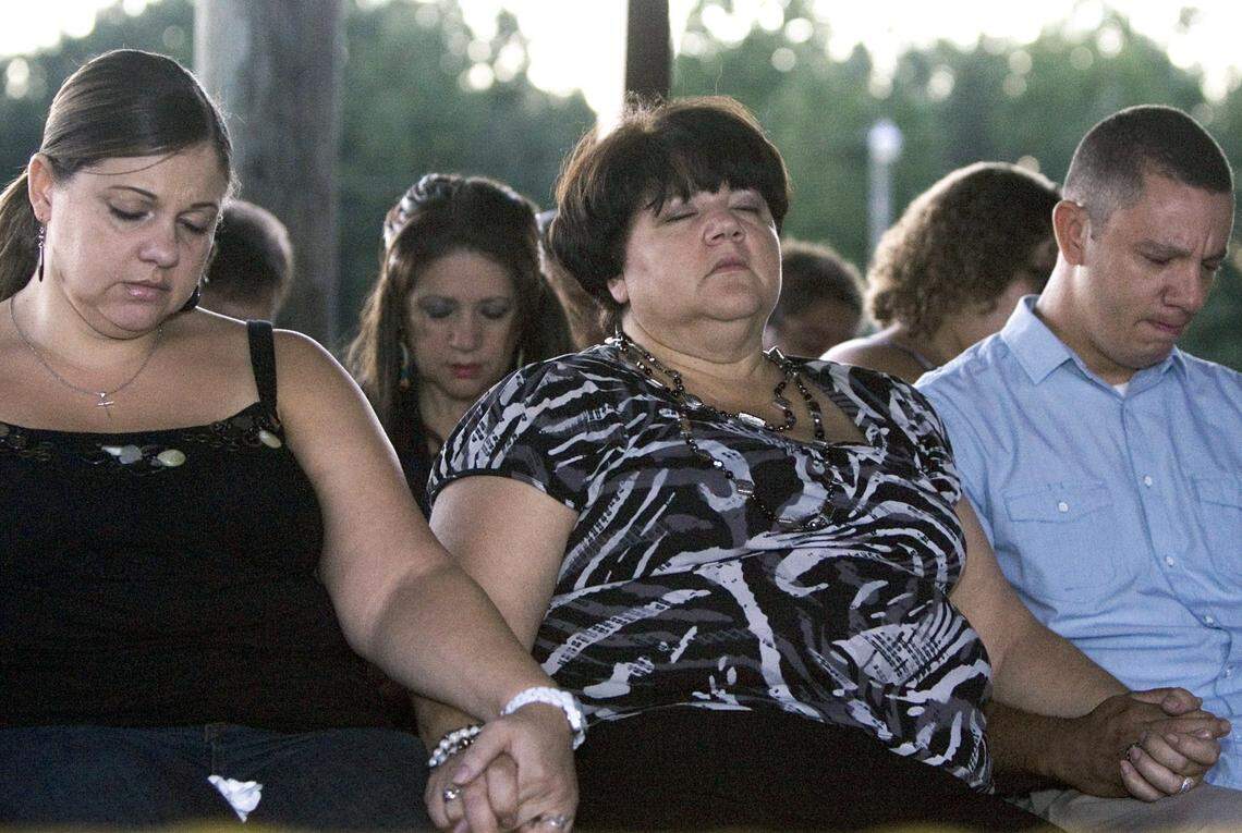 From left, Faith’s sister Rolanda Hedgepeth, mother Connie Hedgepeth and cousin Jonathan Hedgepeth join other family, friends and community members at a candlelight vigil at the Haliwa-Saponi Tribal School in Hollister to remember and pray for Faith Hedgepeth. A member of the Haliwa-Saponi American Indian Tribe, Hedgepeth was found dead in her Chapel Hill apartment on Friday. She was a sophomore, Biology major at UNC-Chapel Hill.