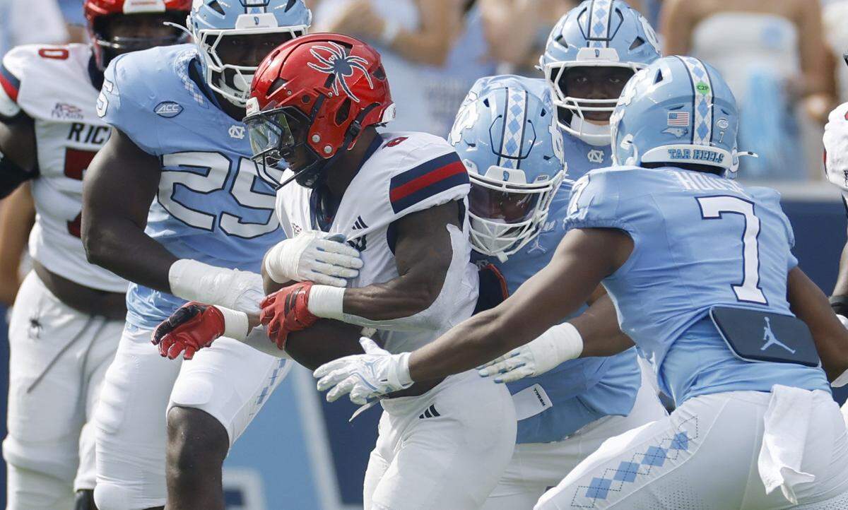 North Carolina defensive lineman Leroy Jackson (91) tackles Richmond running back Andrew King (8) during the first half of UNC’s game against Richmond at Kenan Stadium in Chapel Hill, N.C., Saturday, Sept. 13, 2025.