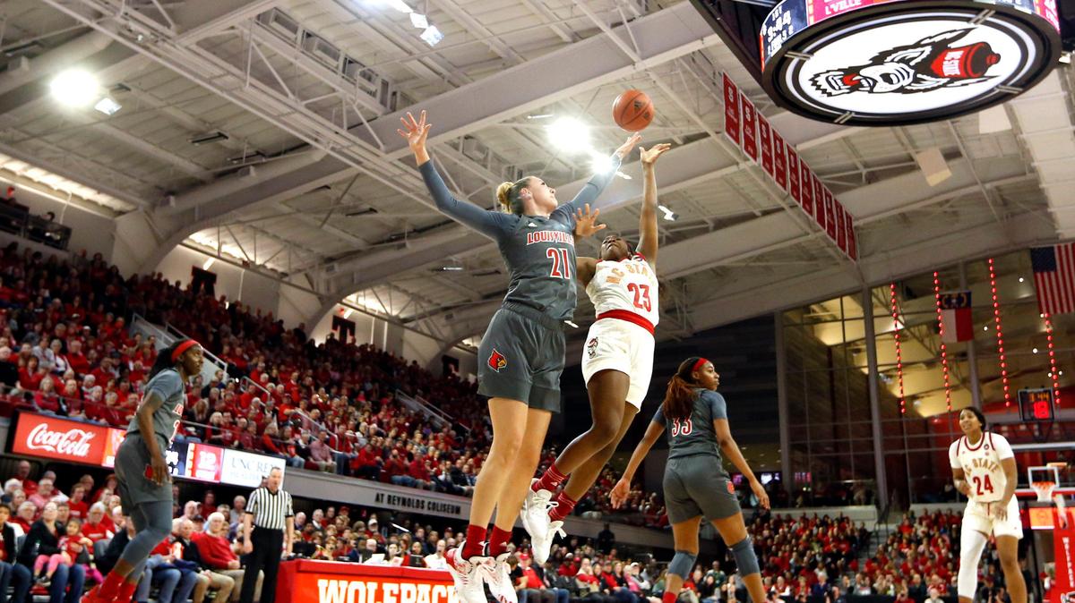 N.C. State’s Grace Hunter (23) shoots as Louisville’s Kylee Shook (21) defends during Louisville’s 66-59 victory over N.C. State at Reynolds Coliseum in Raleigh, N.C., Thursday, Feb. 13, 2020.