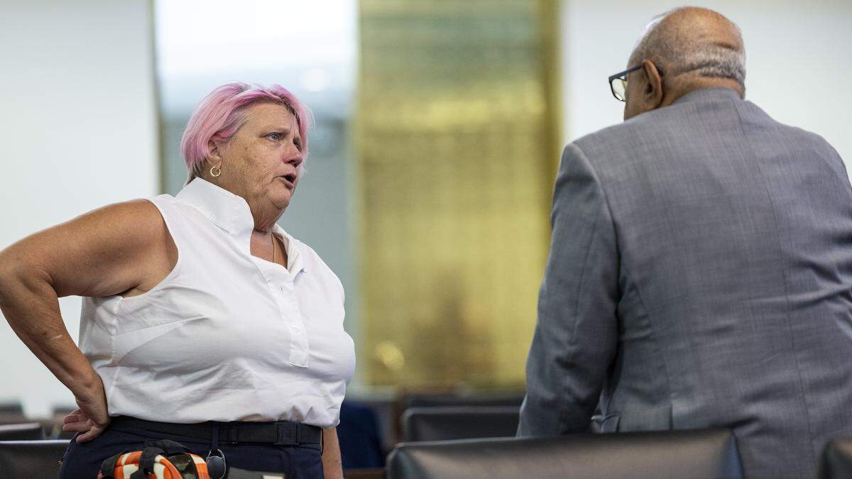 Rep. Allison Dahle of Raleigh, an LGBTQ lawmaker, left, speaks with Rep. Nasif Majeed, a Democrat from Mecklenburg County, after he voted with Republicans to override Gov. Josh Stein’s veto of a controversial bill addressing sexuality, religion in schools, and school libraries—a win for Senate and House Republicans—on Tuesday, July 29, 2025, at the General Assembly.