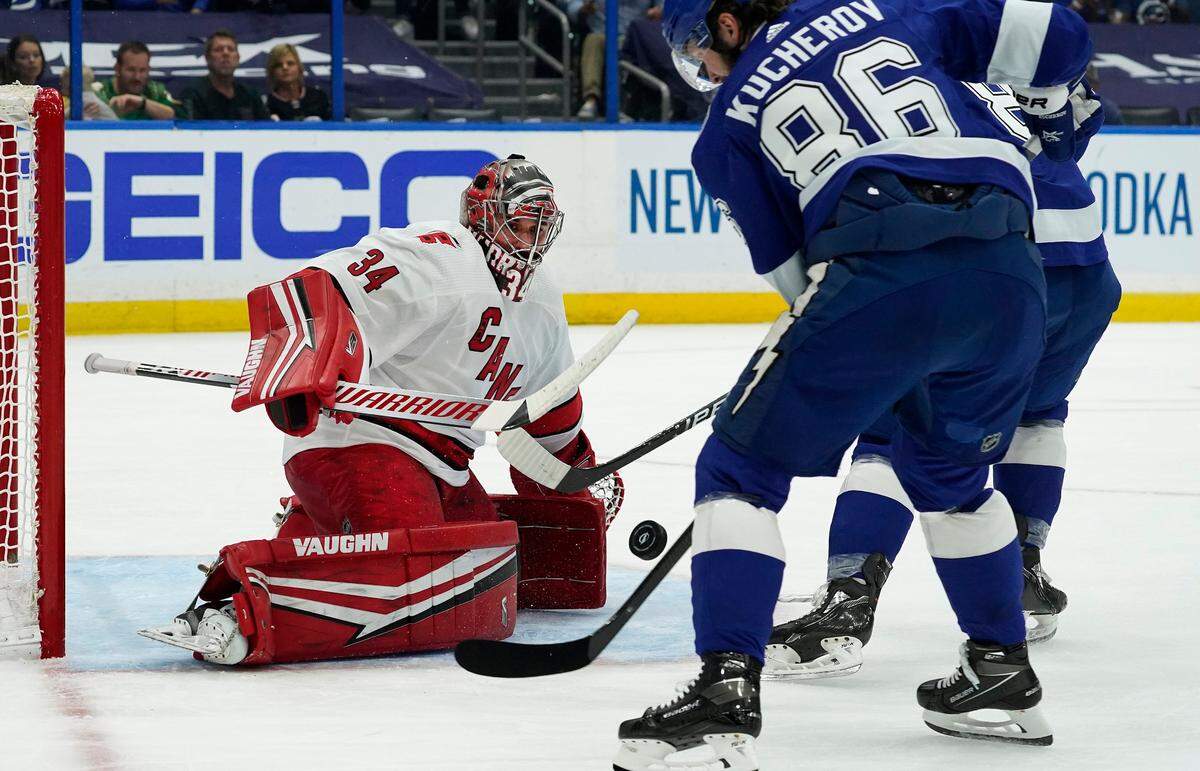 Carolina Hurricanes goaltender Petr Mrazek (34) stops a shot by Tampa Bay Lightning right wing Nikita Kucherov (86) during the second period in Game 3 of an NHL hockey Stanley Cup second-round playoff series Thursday, June 3, 2021, in Tampa.
