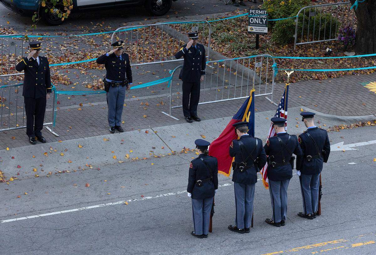 Law enforcement pause for a moment of silence to honor Hailey Brooks at the start of the Raleigh Christmas Parade on Saturday, Nov. 18, 2023. Brooks, an 11-year-old dancer, was struck by a truck during last year’s parade. She died of her injuries.