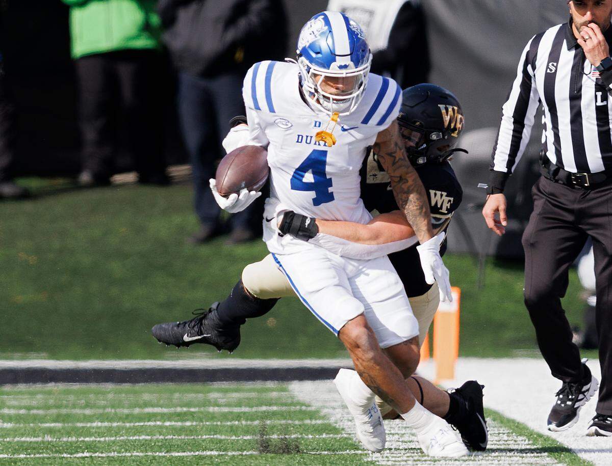 Duke’s Eli Pancol is tackled by Wake Forest’s Dylan Hazen during the first half of the Blue Devils’ game at Allegacy Stadium on Saturday, Nov. 30, 2024, in Winston-Salem, N.C.