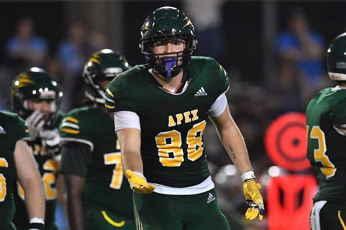 Apex’s Kaleb Morrow (88) looks to the sidelines for direction before a play against Panther Creek during the second half. The Apex Cougars and the Panther Creek Catamounts met in a conference football game in Apex, N.C. on September 20, 2024.