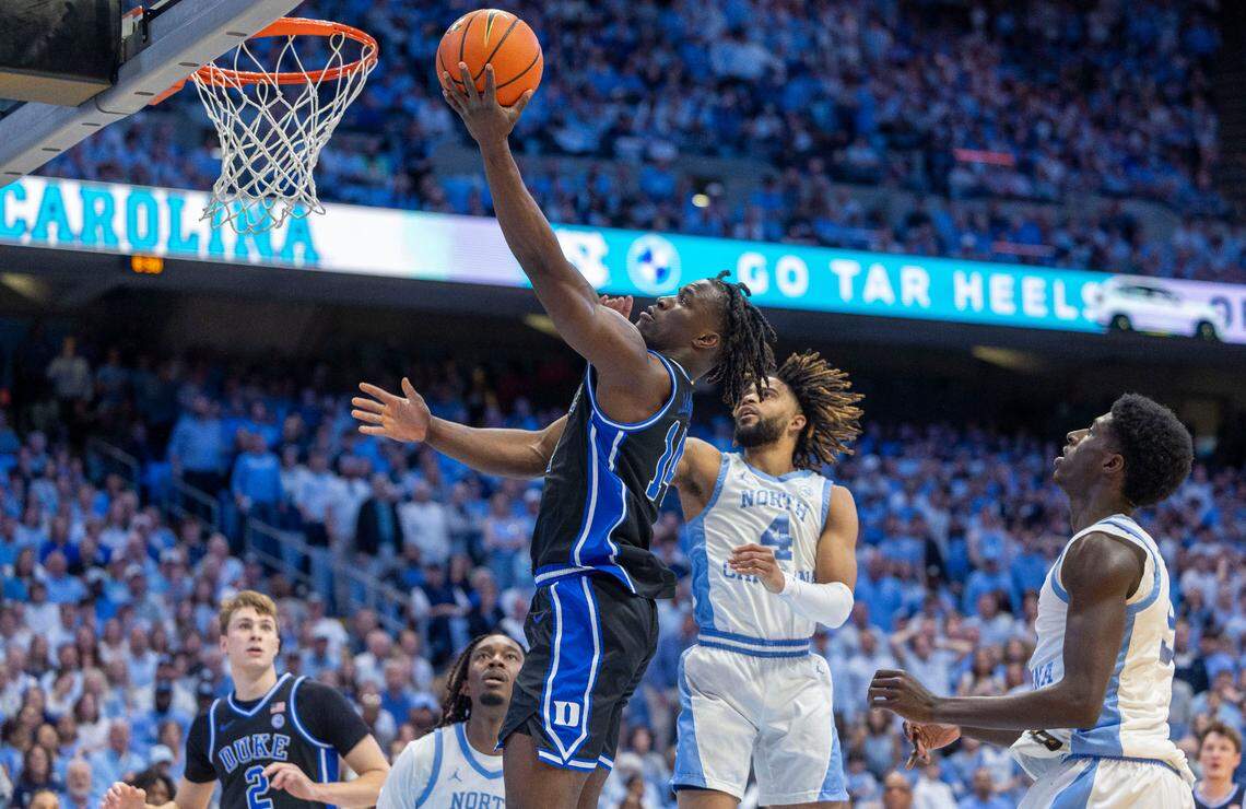 Duke’s Sion James (14) drives got the basket against North Carolina’s R.J. Davis (4) in the first half on Saturday, March 8, 2025 at the Smith Center in Chapel Hill, N.C. James scored 16 points in the Blue Devils’ victory.