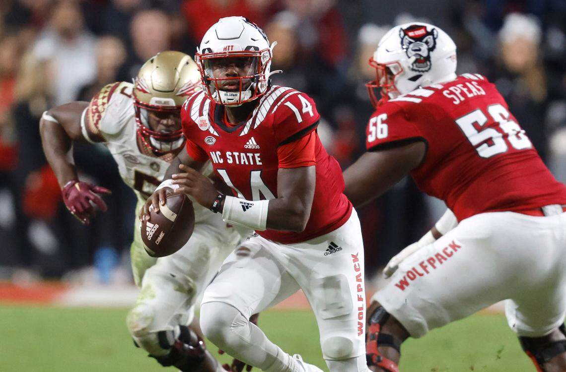 N.C. State quarterback Jack Chambers (14) looks downfield during the second half of N.C. State’s game against Florida State at Carter-Finley Stadium in Raleigh, N.C., Saturday, Oct. 8, 2022.
