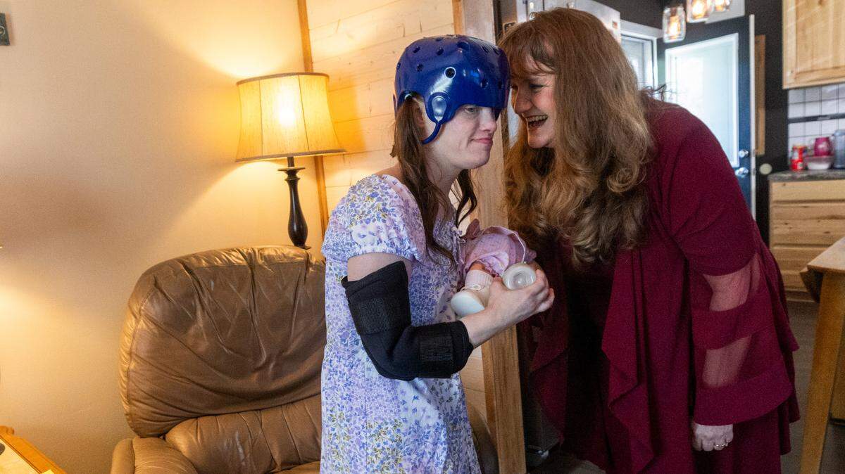 Dana Rhoney spends time with her daughter Samantha, who has a moving disorder and an intellectual disability, at their home near Claremont on Tuesday, April 23, 2024. The Rhoneys filed a lawsuit in 2017 that became known as the Samantha R. case. Disability Rights NC argued that the failure to provide access to community- and home-based behavioral health services violated the rights of people with disabilities.