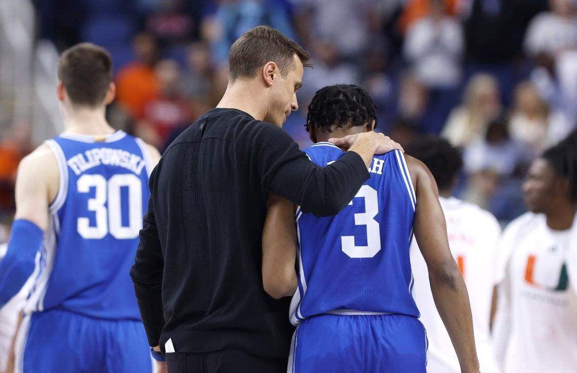 Duke head coach Jon Scheyer talks with Jeremy Roach (3) as they walk off the court at the end of the first half of the Blue Devils game against Miami in the semifinals of the ACC Men’s Basketball Tournament in Greensboro, N.C., Friday, March 10, 2023.