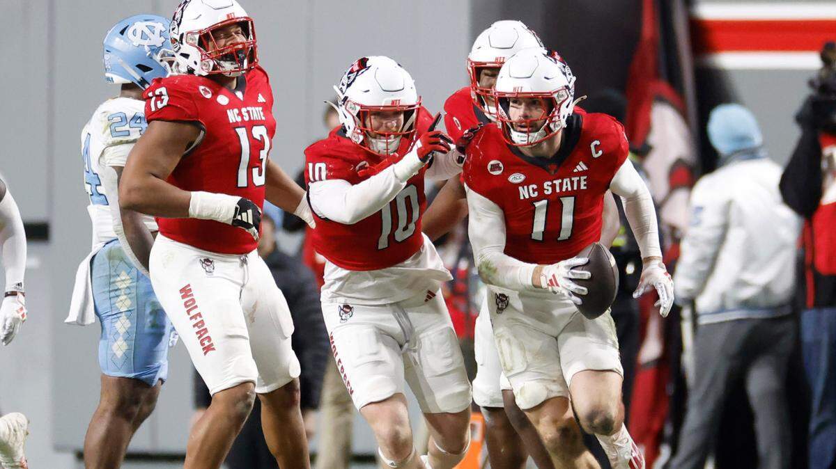N.C. State linebacker Payton Wilson (11) heads back to the sideline after intercepting the ball during the second half of N.C. State’s 39-20 victory over UNC at Carter-Finley Stadium in Raleigh, N.C., Saturday, Nov. 25, 2023.