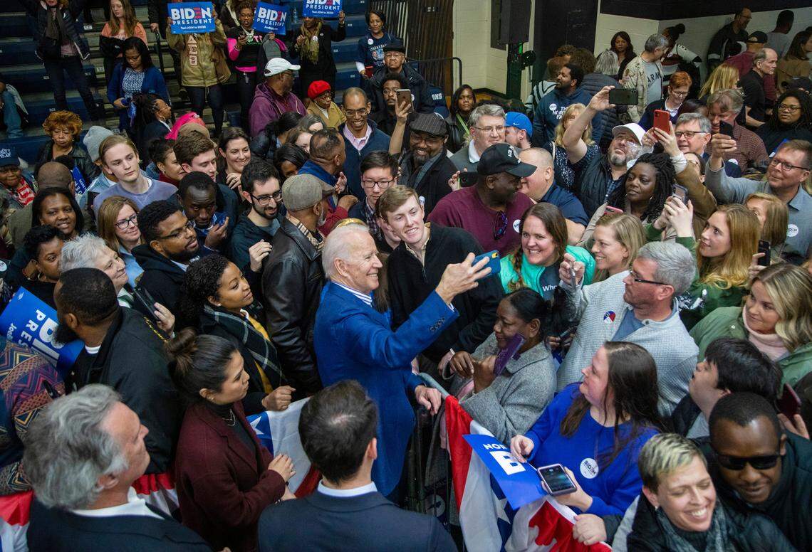 Former Vice President Joe Biden poses for photographs with supporters during a campaign rally at St. Augustine’s University, a private HBCU, Saturday, Feb. 29, 2020 before Super Tuesday.