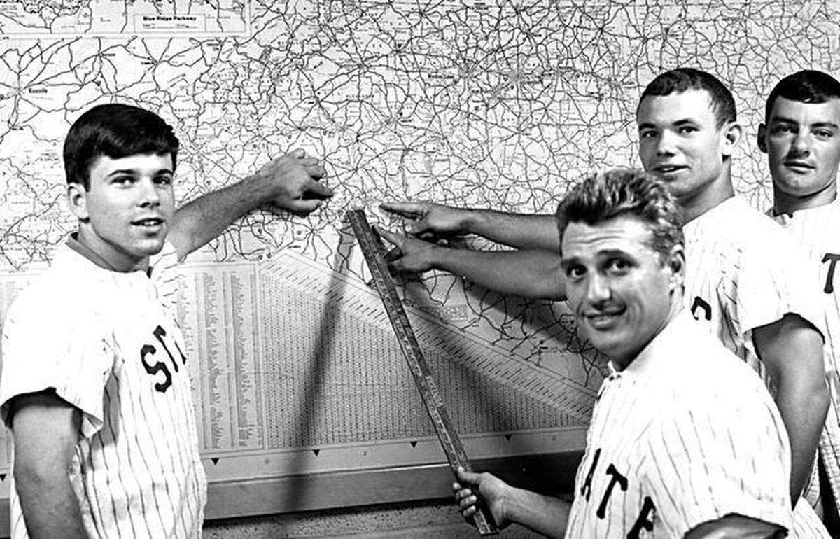 From left, Darrell Moody, Sam Esposito, Freddie Combs, Francis Combs, members of the 1968 N.C. State baseball team, point to Gastonia on a North Carolina map.