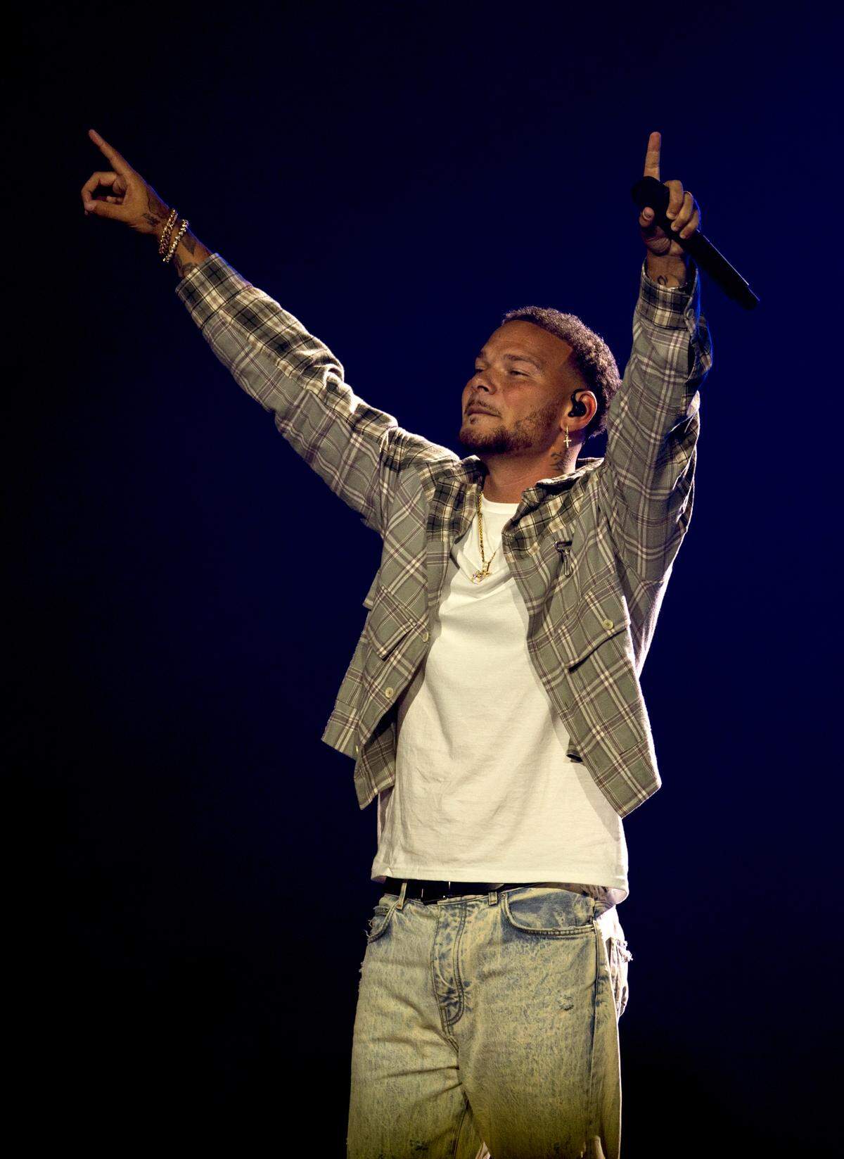 Kane Brown acknowledges the crowd as he brings his “In The Air Tour” to Raleigh, N.C.’s PNC Arena, Friday night, June 7, 2024.
