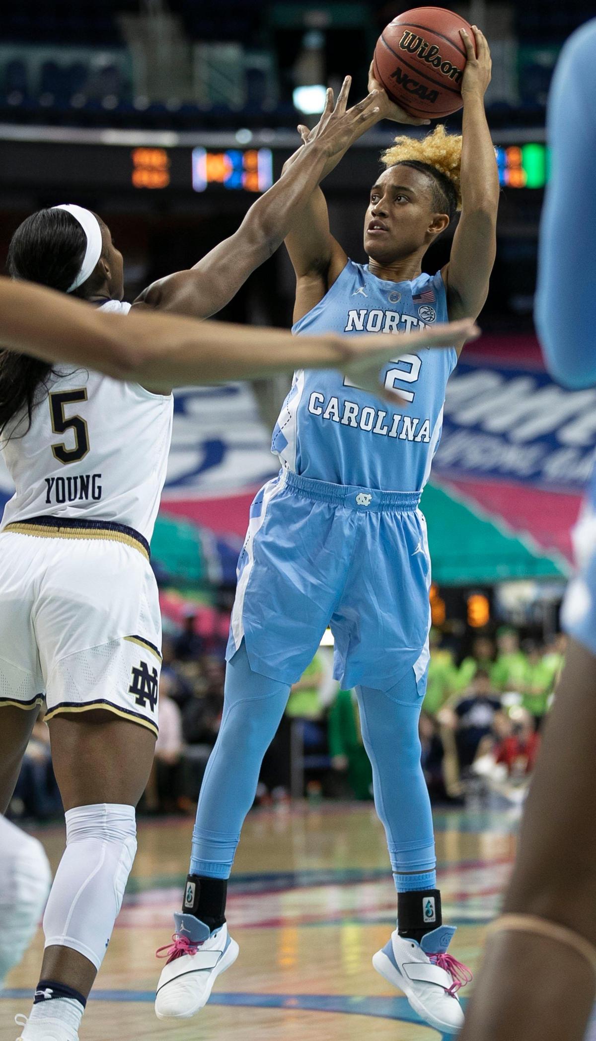 North Carolina’s Paris Kea (22) puts up a shot against Notre Dame’s Jackie Young (5) in the second half during the ACC Tournament on Friday, March 8, 2019 at the Greensboro Coliseum in Greensboro, N.C.