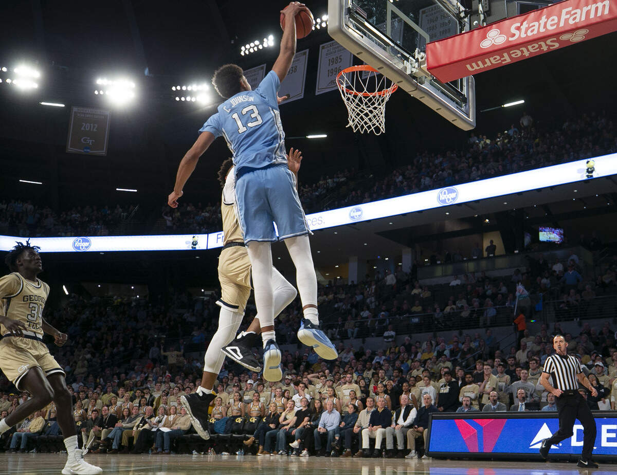 North Carolina’s Cameron Johnson (13) drives to the basket for a dunk over Georgia Tech’s James Banks III (1) in the second half on Tuesday, January 29, 2019 at McCamish Pavilion in Atlanta, Georgia.