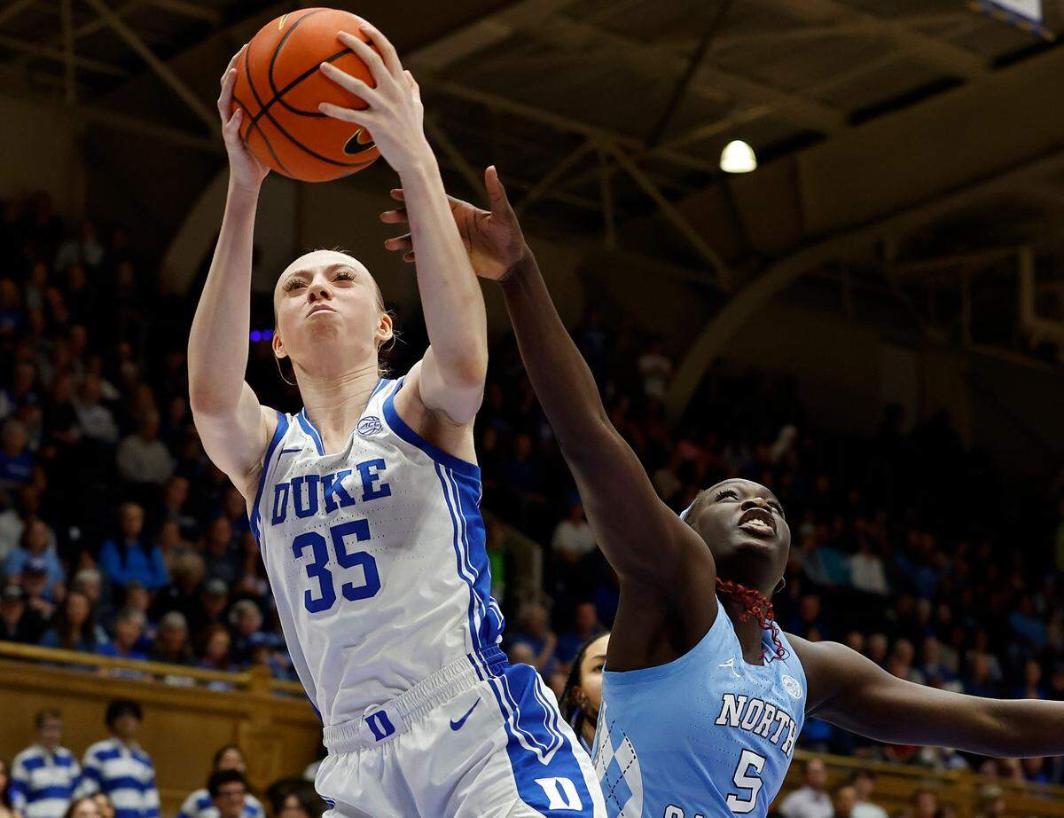 Duke’s Toby Fournier grabs a rebound away from North Carolina’s Maria Gakdeng during the first half of the Blue Devils’ 68-53 win on Thursday, Feb. 27, 2025, at Cameron Indoor Stadium in Durham, N.C.