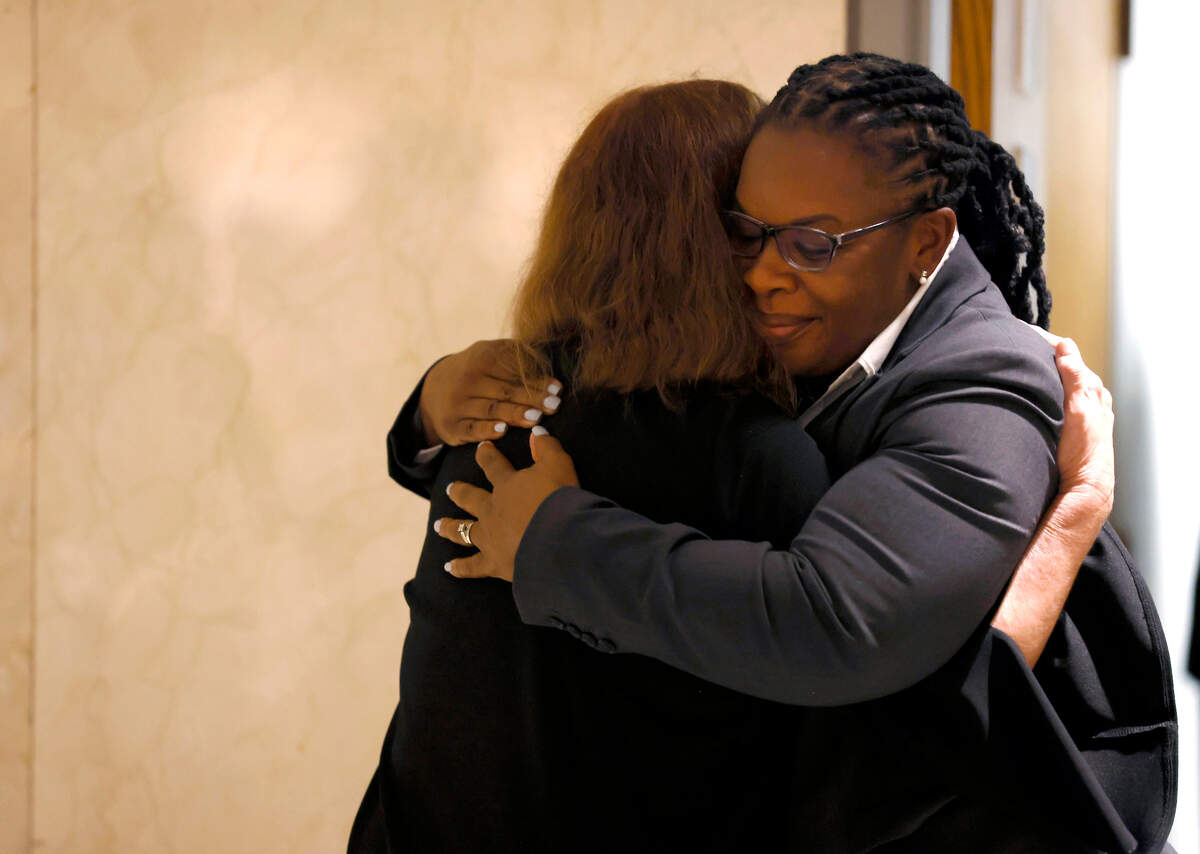 Raleigh Mayor Mary-Ann Baldwin is comforted following a press briefing about a shooting that left five people dead on Thursday, Oct. 13, 2022, in Raleigh, N.C.