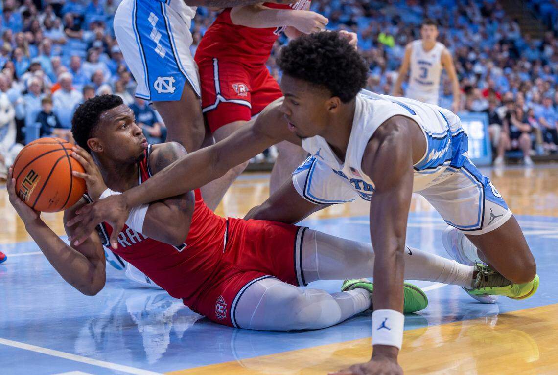 Radford’s Daquan Smith (1) and North Carolina’s Harrison Ingram (55) hit the court for a loose ball in the first half on Monday, November 6, 2023 at the Dean Smith Center in Chapel Hill, N.C.