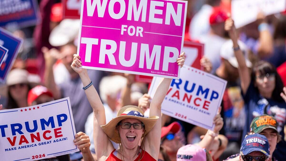 A Supporter cheers during an outdoor rally for former President Donald Trump and his running mate JD Vance at the North Carolina Aviation Museum & Hall of Fame in Asheboro, NC on Wednesday, Aug. 21, 2024.