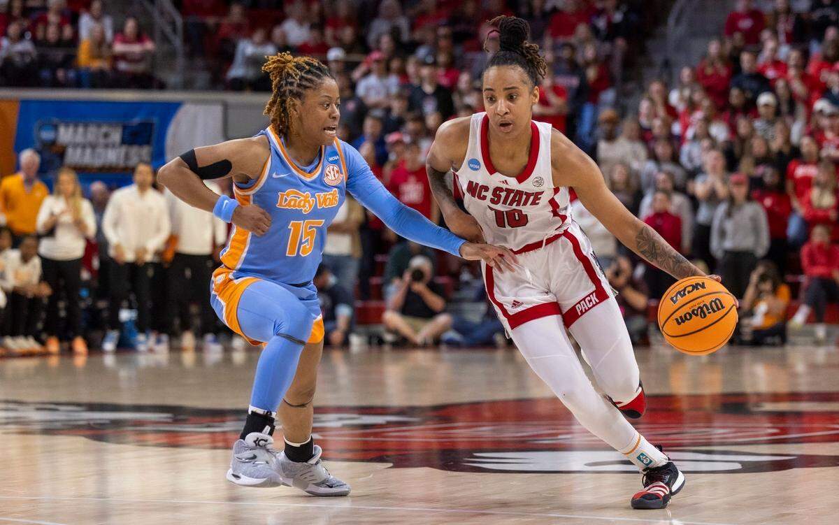 NC State’s Aziaha James (10) maneuvers around Tennessee’s Jasmine Powell (15) during the second half of the second round of the Division I Women’s Basketball Championship at Reynolds Coliseum in Raleigh, on March 25, 2024. The Wolfpack won 79-72.