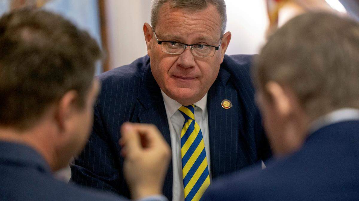 House Speaker Tim Moore, center, confers with his chief of staff, Neal Inman, left, and Rep. Destin Hall, a Caldwell and Watauga County Republican, Thursday, Sept. 21, 2023, prior to the first of several votes on the budget at the General Assembly.