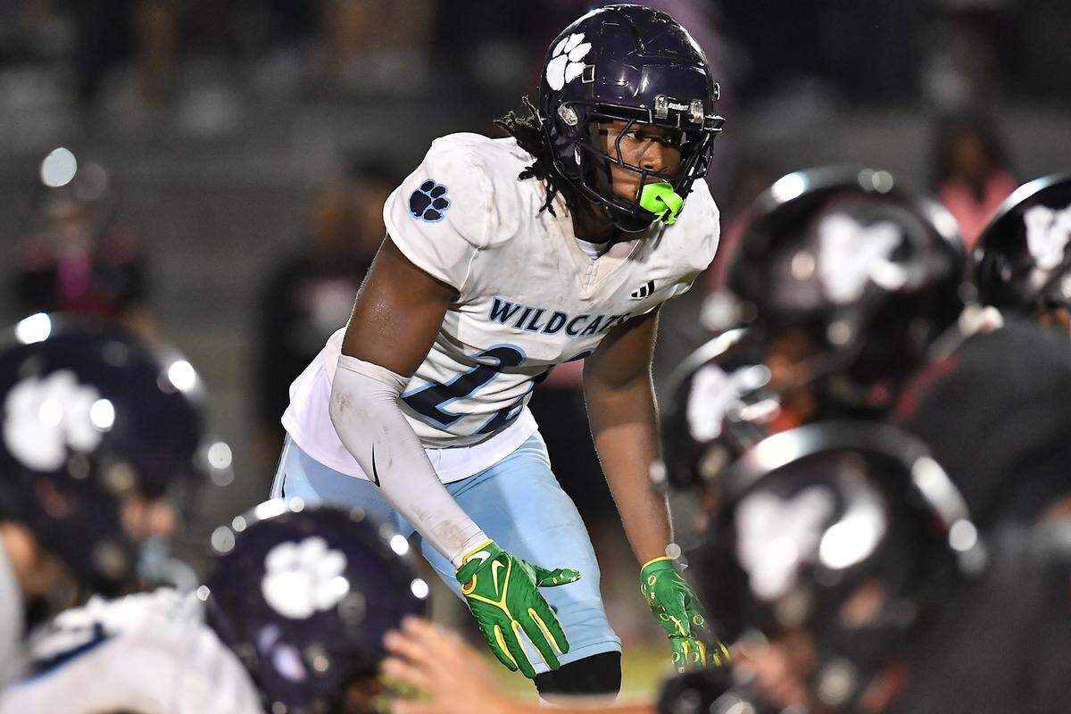 Millbrook defensive tackle Rashad Streets (22) on the line of scrimmage before the start of a down against Rolesville in the first half. The Millbrook Wildcats and the Rolesville Rams met in a conference football game in Rolesville, N.C. September 26, 2025