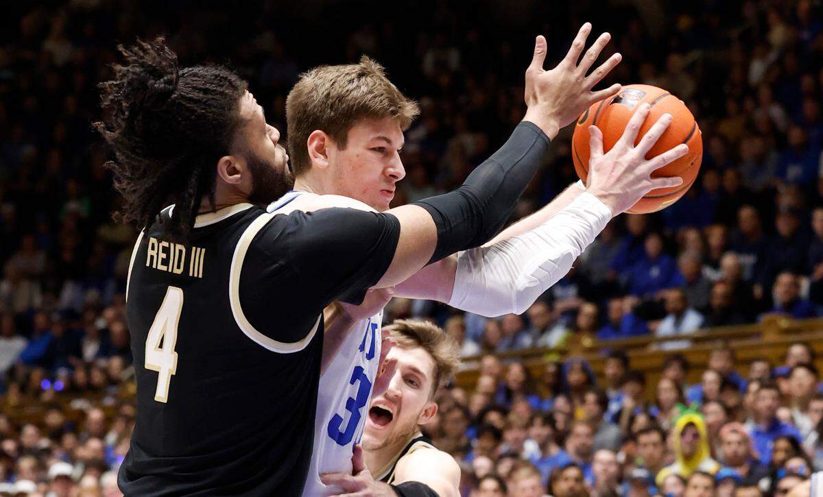 Duke’s Kyle Filipowski (30) drives past Wake Forest’s Efton Reid III (4) during the first half of Duke’s game against Wake Forest at Cameron Indoor Stadium in Durham, N.C., Monday, Feb. 12, 2024.