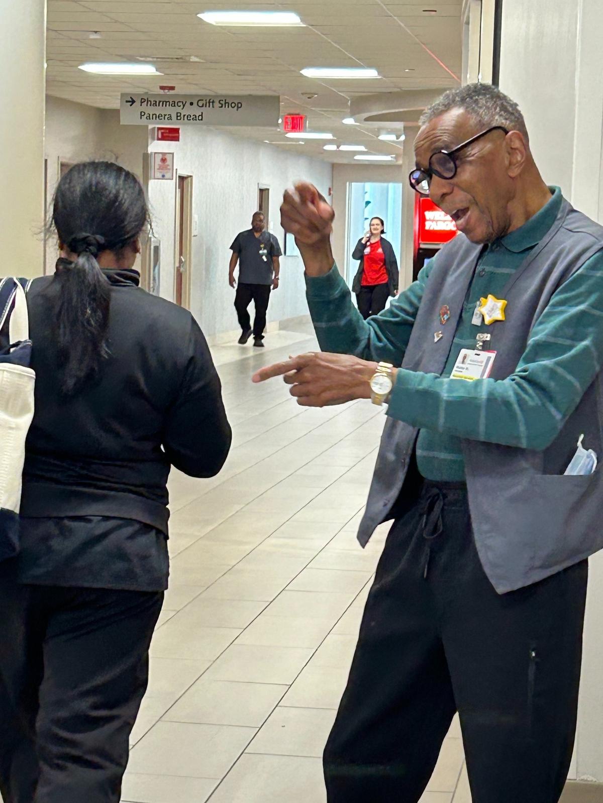 Walter Moreland belts out “Love Train” as the Friday crowd pushes through WakeMed, most of them smiling at his performances.