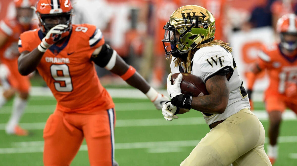 Wake Forest Demon Deacons running back Christian Beal-Smith (26) during the first half of an NCAA college football game against Syracuse on Saturday, Oct. 31, 2020, in Syracuse, N.Y. (Dennis Nett/The Post-Standard via AP)
